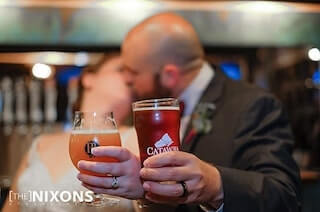 wedding couple drinking beer